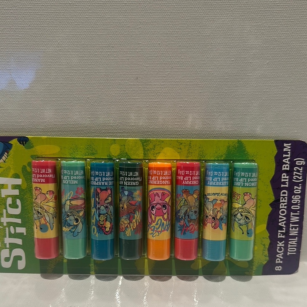 NIB Disney Stitch (8) Piece Flavored Lip Balms.